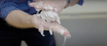 Shaping oobleck into a ball by applying stress.